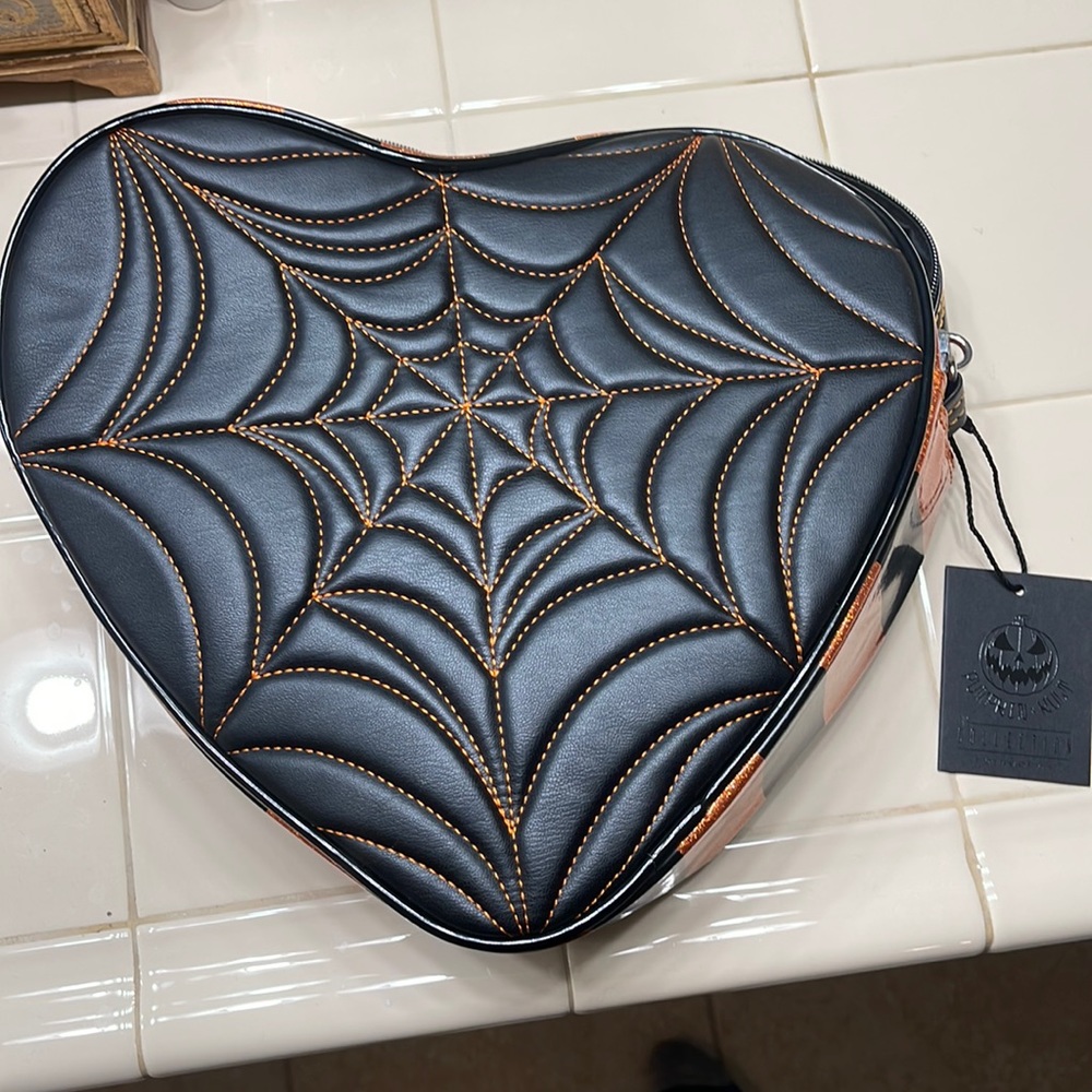 Love Pain and Stitches Orange and Black Heart backpack